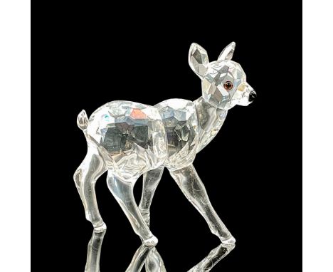 This Swarovski crystal fawn was part of the Rare Encounters collection. The fawn has a clear faceted body, smooth molded legs