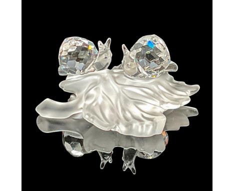 These Swarovski crystal baby snails on a vine leaf were members of the In the Secret Garden collection. The baby snails are m