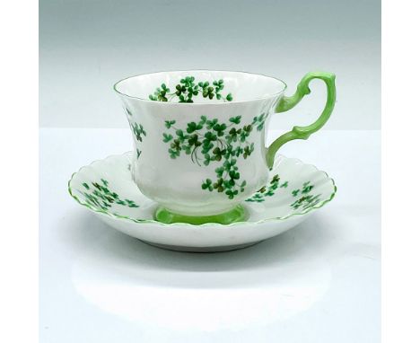 A set of white cup and saucer decorated in shamrocks and green trims. Royal Albert backstamps. Cup: 4.5"L x 3.5"W x 2.75"H. S