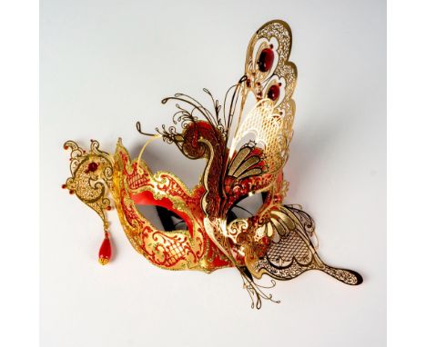 Handcrafted luxury butterfly mask in papier mache and gold-tone metal filigree. It is adorned with ruby red rhinestones of di