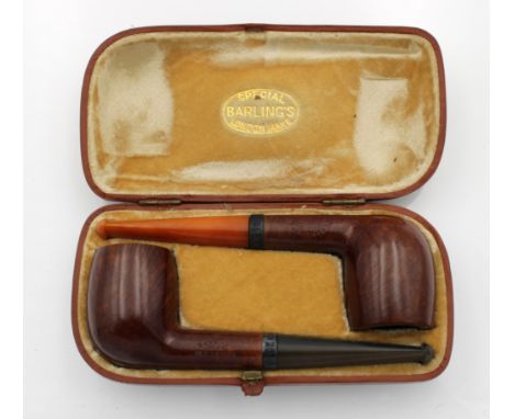 A cased pair of unused George V Barling briar pipes, with silver collars, Edwin &amp; William Barling, London,1924, both stam