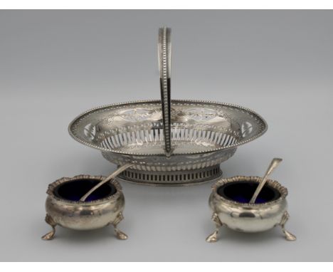 A silver pierced footed bon bon basket, Haseler Brothers, Chester, 1901, 16.7cm. wide, together with a pair of silver salts r