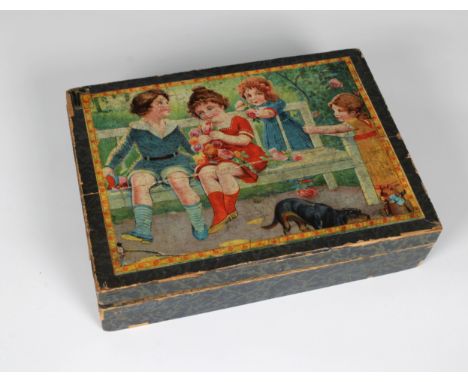 A Victorian block puzzle, the twelve blocks featuring children playing, boxed.