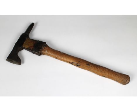 A WWI German pioneer field trench axe in leather sheath, 49cm. long.