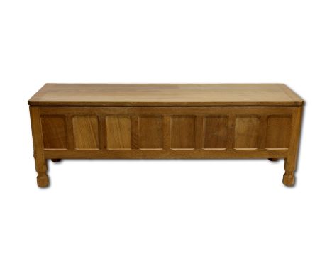 Workshop of Robert Mouseman Thompson (Kilburn), An English oak panelled blanket box, 46cm x 136.5cm x 39.5cm