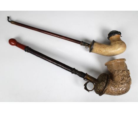 A large 19th century hand carved Austrian meerschaum pipe, high relief, depicting a pack of wolves and rider on horseback in 