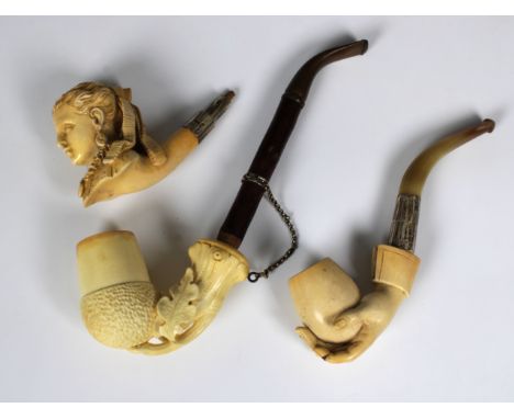 An unusual unused meerschaum calabash /bent pipe, the bowl fashioned as an acorn, birch stem with white metal belt mount with