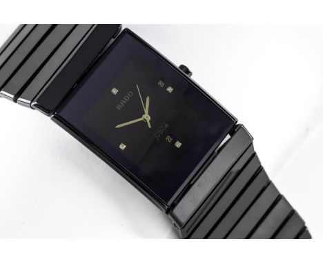 A gentleman's Rado Jubile ceramic wristwatch, set with four diamond indicators and date aperture, boxed with service history