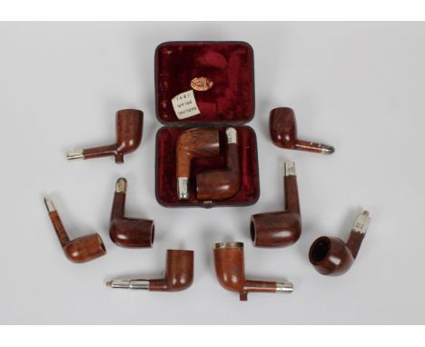 A collection of ten unused silver mounted Barling briar pipes without mouthpieces, of varying dates and shapes, to include a 
