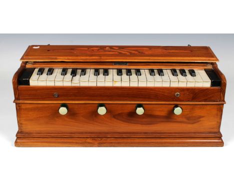 A hardwood cased harmonium, Musical Depot P. RANA &amp; Co Calcutta, 54.2cm. wide.