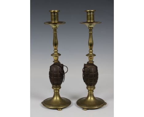 Pair of WW1 Period Mills Grenade Candlesticks, cast body complete with lever and split pins to the centre of the brass candle