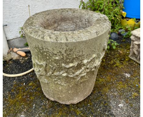 A composite stone cylindrical bird bath / planter, of tapering form, decorated in high relief with ivy, 40.7 x 43.2cm.