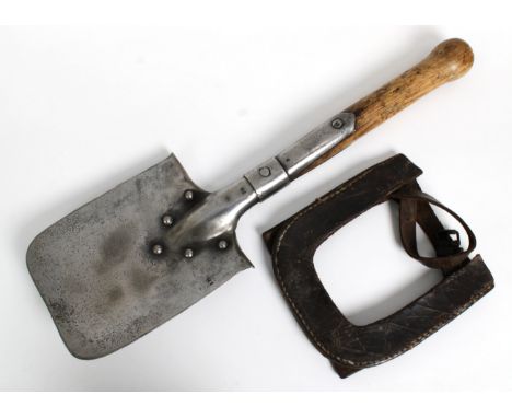 A German entrenching tool / shovel, blade stamped '228', metal furniture stamped '38', wooden turned handle, leather cover an