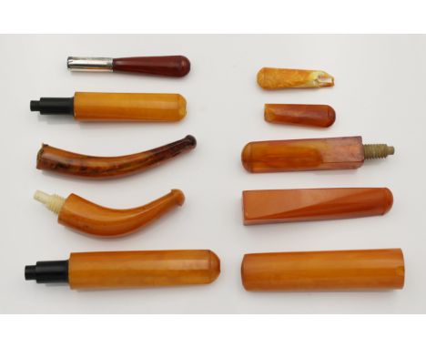 A collection of ten amber or amber style pipe mouthpieces, six appear to be in good order. * Laxey pipe factory collection.
