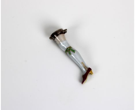 A porcelain and white metal mounted novelty snuff mull, 19th century, modelled in the form of an elongated leg, wearing stock