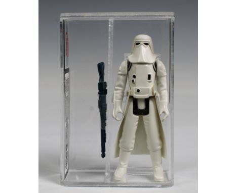 A loose, graded vintage Star Wars Imperial Stormtrooper "hard torso", with original weapon and vinyl cape. Cased in acrylic a