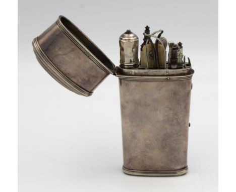 An early 19th century silver etui, of tapered form with reeded borders, containing a range of fitted accessories, to include 