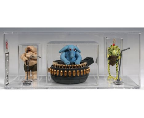 A loose, graded vintage Star Wars Sy Snootles &amp; the Max Rebo band, with mic stands and instruments, cased in acrylic. Gra