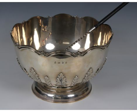 A silver monteith with shaped rim and applied acanthus decoration to body, Courtman Silver Ltd, London, 1975, standing on a p