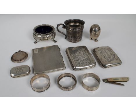 A collection of silver smalls, various dates and maker's, comprising of three cigarette cases, three napkin rings, tankard, o