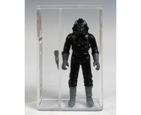 A loose, graded vintage Star Wars Tie fighter pilot with original blaster., Cased in acrylic and graded by UK Graders. Figure