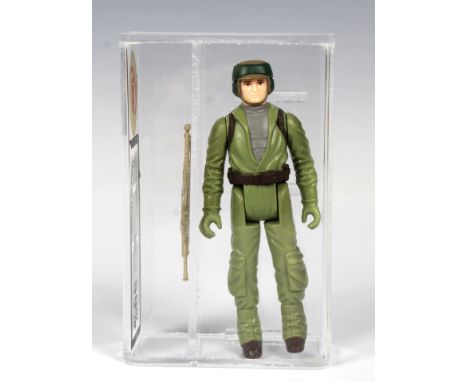 A loose, graded vintage Star Wars Rebel Commando with original weapon., Cased in acrylic and graded by UK Graders. Figure 90 
