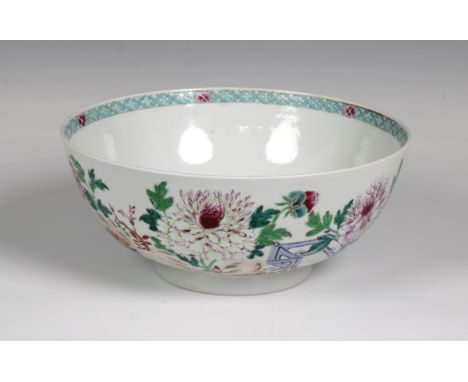 A Chinese famille rose enamelled punch bowl, In the Qianlong manner, decorated with flowering chrysanthemums, 11cm x 25.5cm