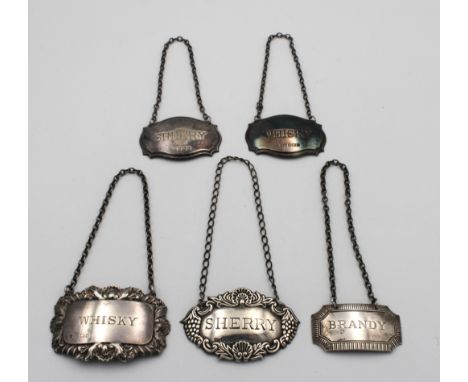 Five vintage silver decanter labels, of varying forms and dates, Brandy; 2x x Whisky; 2 x Sherry. (5)