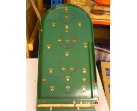 Vintage Chad Valley Bagatelle board, green painted with gilt numerals and steel balls (57cm x 37cm) 