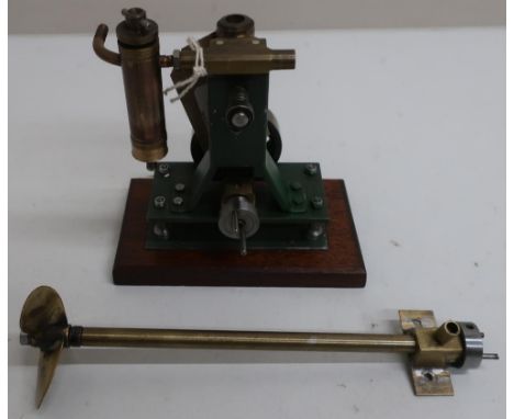 Brass and cast metal live steam single cylinder Marine engine, with brass three blade propeller shaft, on wooden stand (14cm 