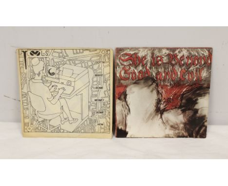 Two 45'' RPM records one by The Tools and another by The Pop Group. 