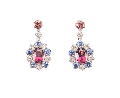 A PAIR OF TOURMALINE, DIAMOND AND SAPPHIRE PENDANT EARRINGS each surmount claw-set with a circular mixed-cut orange pink tour