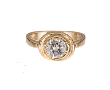 A DIAMOND RING bezel-set to the centre with a round brilliant-cut diamond weighing approximately 0.94cts, within a gold oval 