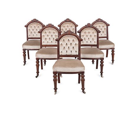 A SET OF SIX MAHOGANY UPHOLSTERED CHAIRS, 19TH CENTURY each arched carved top rail centred by a vacant cartouche, each arched