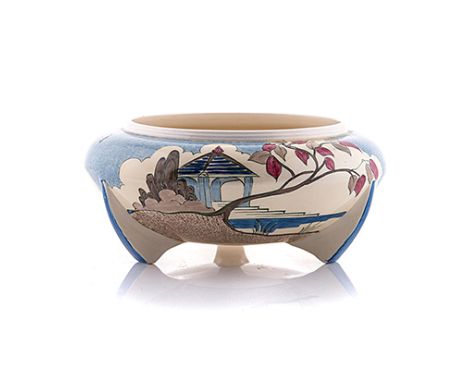 A CLARICE CLIFF ‘BLUE JAPAN’ PATTERN TRIPOD DISH, 1933 the exterior painted with a mottled blue sky and brown ground with a s