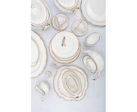 A ROYAL ALBERT ‘SNOW QUEEN’ PATTERN PART DINNER SERVICE, 20th CENTURY each with a scalloped gilt border against a white groun