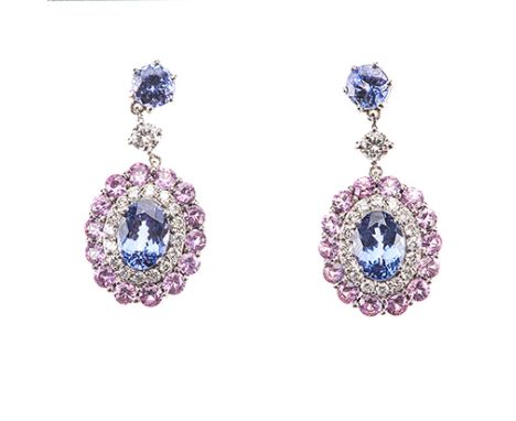 A PAIR OF TANZANITE, PINK SAPPHIRE AND DIAMOND PENDANT EARRINGS each surmount claw-set with a circular-cut tanzanite weighing