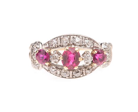 A RUBY AND DIAMOND RING claw-set to the centre with a mixed-cut oval- and circular-cut ruby weighing approximately 0.90cts in