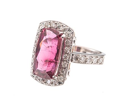 A RUBELLITE TOURMALINE AND DIAMOND RING centred with a cushion-cut rubellite tourmaline weighing approximately 5.58cts, the c