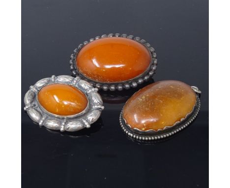 2 Vintage Danish silver-mounted amber brooches and a pendant, largest length 48.6mm, 44.5g total, (3)

All in fair overall co