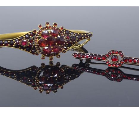 A Victorian gilt-metal and garnet cluster matching hinged bangle and bar brooch set, set with rose-cut garnets, unmarked, ban