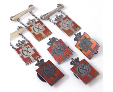 GEORG JENSEN - a set of 7 Danish sterling silver and red enamel Kingmark badges and brooches, badge height 24mm, 25.4g total,