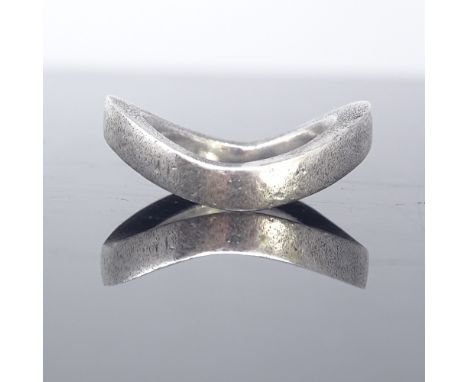 HANS HENRIK NYGAARD - a Danish sterling silver modernist ring, thick-cast wave form, maker's marks HHN, band width 3.8mm, siz