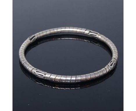 A Danish unmarked silver Viking Revival stylised slave bangle, band width 4.6mm, intermal diameter 63mm, 16.1g

Good overall 
