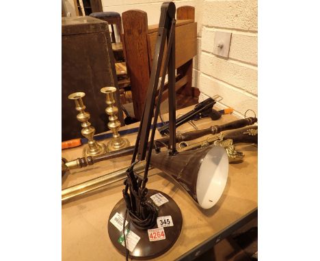 Wall mount gun anglepoise lamp and brass candlesticks  CONDITION REPORT: The electrical items included in this lot have been 