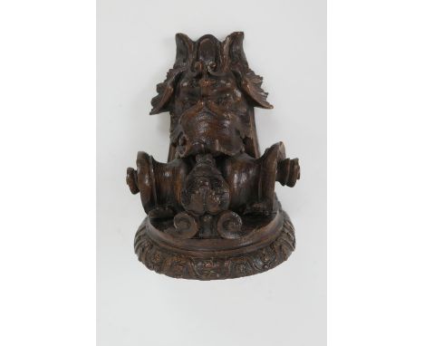Late 17th Century carved oak bracket, carved with a grotesque mask and paper scroll, 22cm x 16.5cm (Please note condition is 