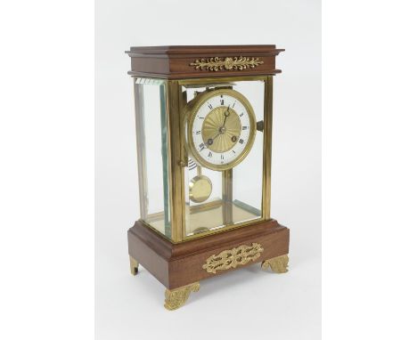 French mahogany and ormolu mounted four glass mantel clock, late 19th Century, in the Empire style, the white enamelled chapt