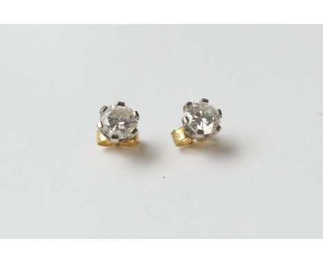 Pair of diamond stud earrings, round brilliant cut stones, each of approx. 0.75ct, well matched in colour, estimated as J/K i