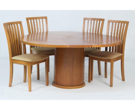 Skovby Kirsebaer cherrywood finish circular extending dining table, when closed 120cm diameter, opening to three integral enc