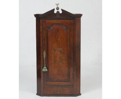 George III mahogany and inlaid hanging corner cupboard, circa 1790, with architectural broken dentil cornice centred with a b